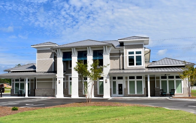 Freshly painted charcoal exterior wall with crisp white trim
