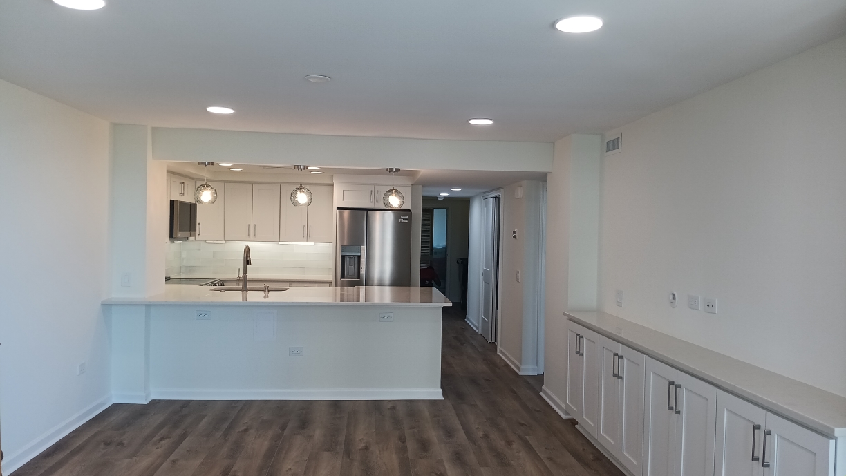 Freshly painted charcoal exterior wall with crisp white trim